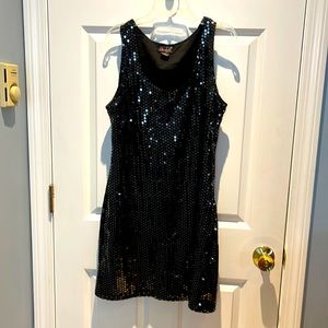 A black sequined sleeveless dress